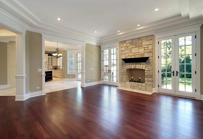 wide-angle shot of wood flooring in a spacious hallway